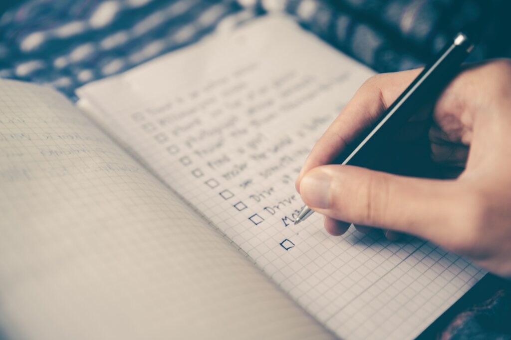 A notebook with a handwritten list.